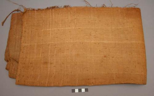 Large piece of woven straw cloth, fringe on one side