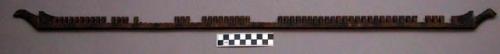 Comb, for loom, carved wood, tapered teeth, some broken or missing