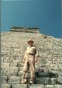 Gordon Willey standing on the staircase of the Castillo of Chitzen Itza