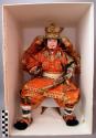 Shogun doll seated on stool