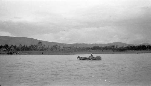 Person crossing river in horse-drawn cart