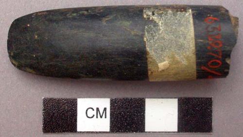 Fragment of stone chisel used for gouging hole in axe handle (putu)