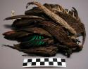 Small tobacco net decorated with feathers, cocoons of case moth(hanom)