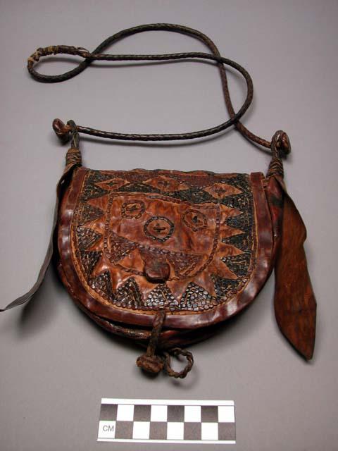 Old man's bag of tan leather with red and black leather decoration