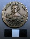 Metal commemorative coin, impressed image of George Peabody.