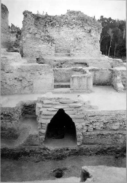 A-V: looking E: cut thru main court showing construction from natural limestone