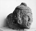 Sculptured stone-tenoned human head