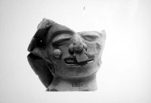 Portion of pottery head.  Height, 13.0 cm.  Peabody Museum