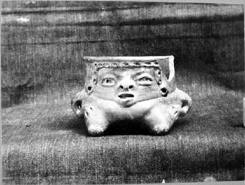 Reddish-brown ware wide-mouthed effigy jar.