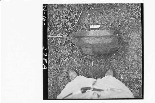 Fragmentary roof drain(?) stone found near surface, central west slope of mound.