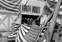 Flag draped gangway leading to ship