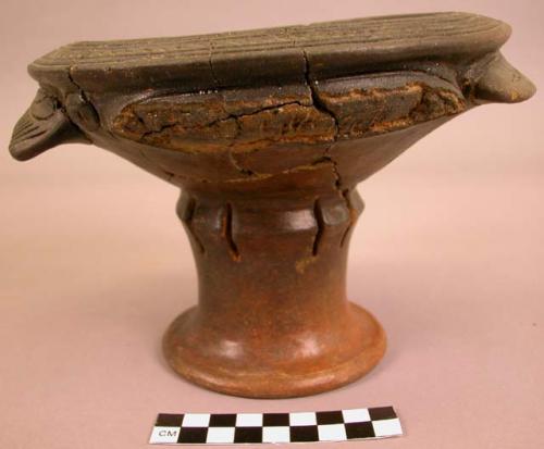 Restored pedestal-base pottery vessel