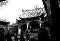 People standing in temple courtyard