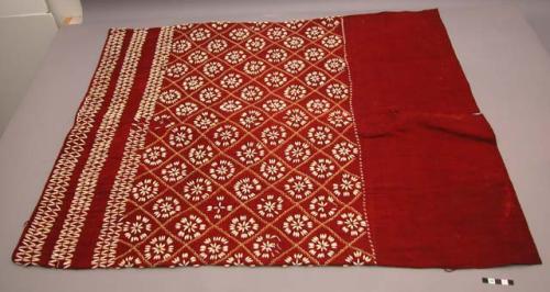 Women's garment of red cloth ornamented with coix seeds