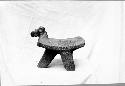 Tripod metate with head