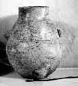 Ceramic jar, cylindrical neck, perforated handles at shoulder and base