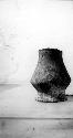 Ceramic pedestal vase, chipped rim