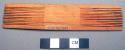 Wooden comb - solid center, comb on both ends, carved; used by both +