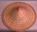 Large conical hat of palm leaves strung together by split cane