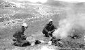 Men preparing food in desert