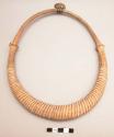Wooden neck ring worn by men only on feast days