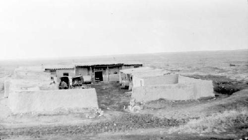 Buildings with wall around outside in desert