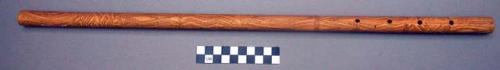 Flute, end-blown. Bamboo flute with four finger holes; design carved into surfac
