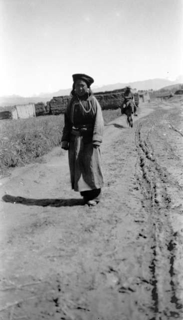 Woman standing in road