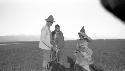 Men and boy standing in desert