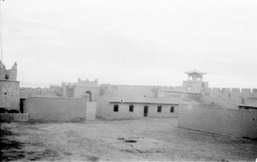 Walls with crenellations around buildings