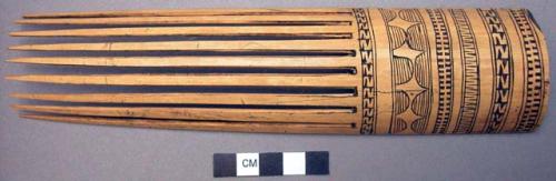 Bamboo comb--black filled incisions; probably modelled after Shortland+