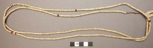 Shell money - string of white beads with few red ones