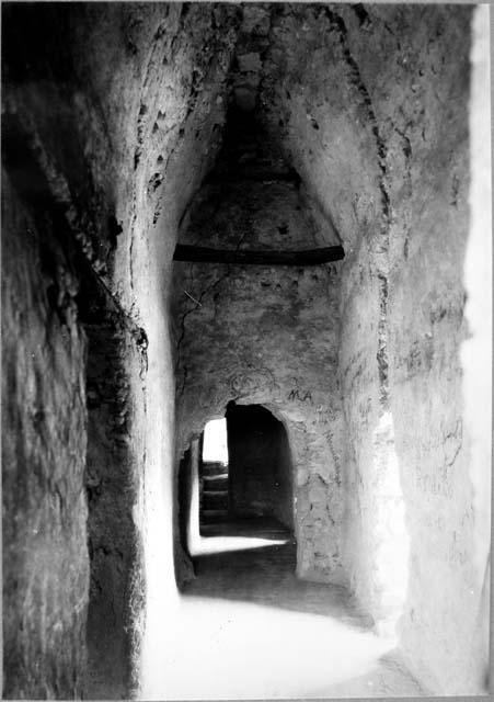 A-XVIII: West end of Room 9 and doorway into Room 8 and interior stairway