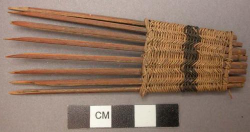 Comb - several pointed sticks bound together at ends; binding is +