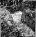 Trench on top of mound B showing top soil and highest cement flow