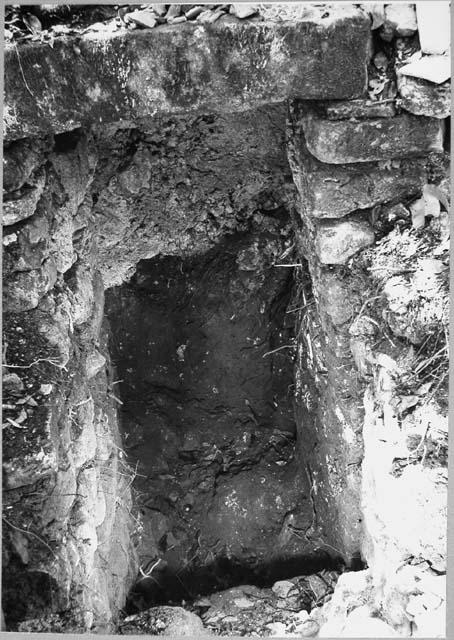 Stone lintel and jambs which abut cliff behind Structures 4, 6, and 9.