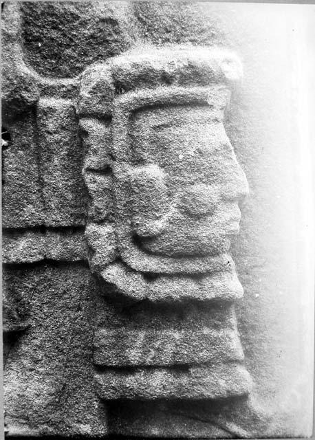 Stela E, south side, knee ornament