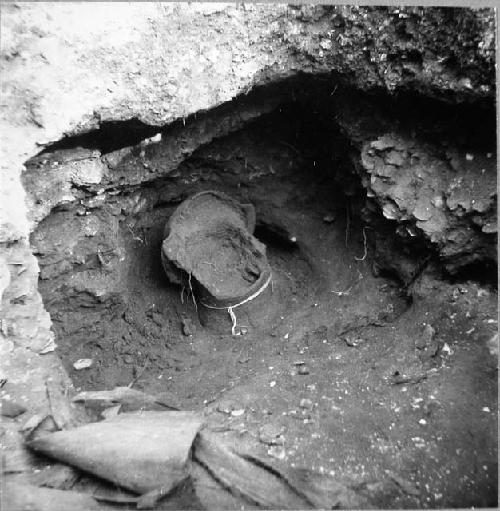 Pit in fill of south platform of temple mound. A coarse incised vessel