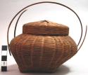 Small wicker basket with two handles
