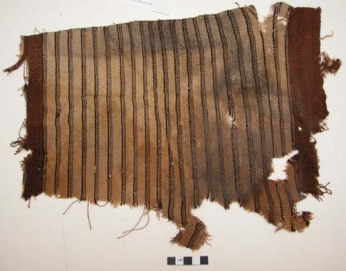 Organic, woven fiber, textile fragment, dark brown stripes on tan, brown borders