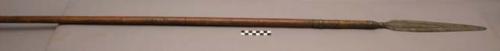 Wood spear with decorative wide copper-colored band just below +