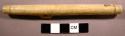 Ivory drinking tube. Cream colored with brown specks.