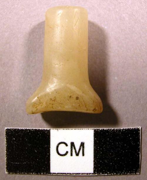 Chipped quartz labret. Oval-shaped head is flared, slightly concave.