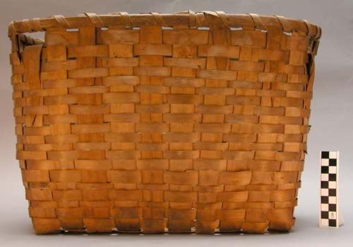 Pack basket, ska-mut, carved. Strap on back or side.