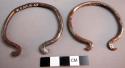 2 narrow iron bracelets with recurved ends