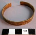 Girl's bracelet made from trade brass - incised geometric decoration