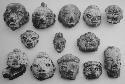 Figurine heads (14), red-brown, unslipped.