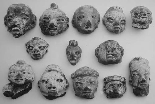Figurine heads (14), red-brown, unslipped.