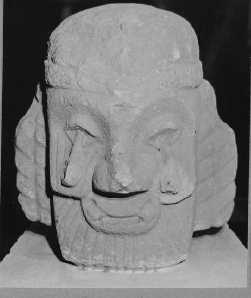 Sculptured stone - human head, tenoned