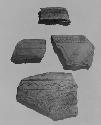 Potsherds, orange ware, incised decor.